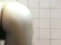 A Hairy pussy, nice ass and alright tits in a voyeur shower porno