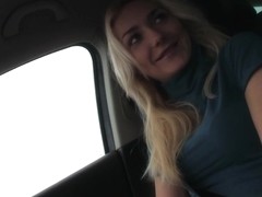 Blonde hitch hiking girl tugs the driver