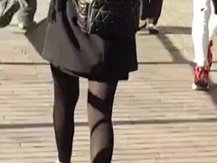 Mixed race lady in skirt and tights