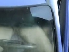 Amateur voyeur films a hot couple fucking in a car.