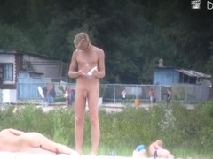 Two lovely naked philanders are sunbathing naked