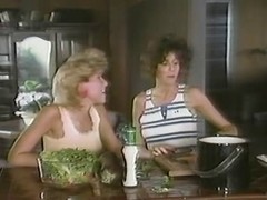 Two horny lesbian sluts in a retro porn video