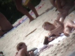 Naked mature babe shot on a nudist beach on hidden cam