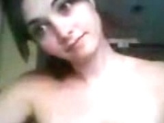 Young brunette demonstrating her saggy tits on webcam