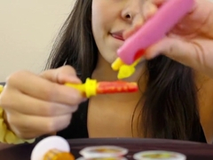 Young girl sucks lollipops