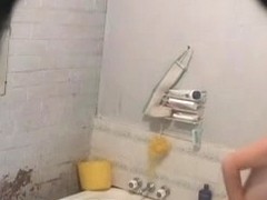 Nude babe takes a bath to clean her dirty pussy