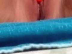 Pierced clit on the beach