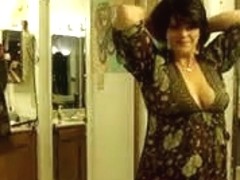 Strip show from a plump brunette with big boobs