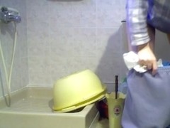 Unsuspecting woman in a bathroom caught on my hidden camera