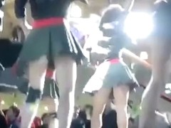 Short pleated skirts and heels on sexy dancing girls