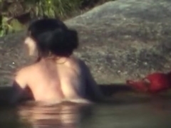 Voyeur busts a girl couple having sex in the lake