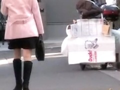 Cute Asian babe in a pink jacket gets a street sharking.