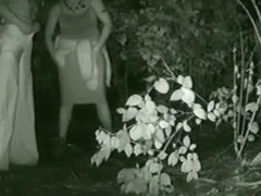 Piss porno filmed outside in a spot with low growing vegetation