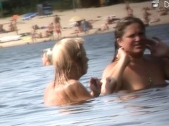 Nude amateur is having entertainment on beach spy camera