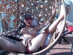 hot teen girl rubs her pussy on balcony