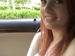 Redhead girl with huge breasts offers sex for a lift