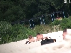 wide open and bending over on the beach with the nudists