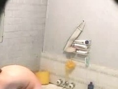 brunette girl gets nude and takes a quick bath in a shower porno