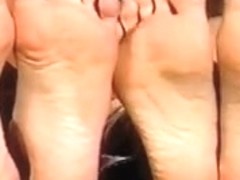two golden-haired show their soles.