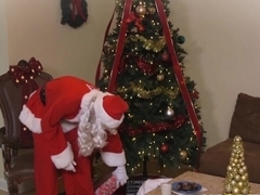 Busty milf getting banged by Santa under the Christmas tree