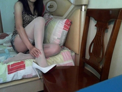 Webcam Showing Chinese Girl Massaging Sprained Ankle in Stockings