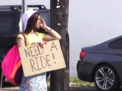 Stranded brunette hair in a mini petticoat receives a ride hitchhiking