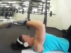Fitness girl training biceps triceps