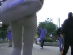 A brunette with appetizing ass in the street candid video