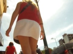Upskirting sexy babe at the train platform in sexy white skirt