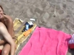 A perfect couple makes love on the beach