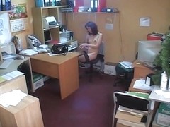 Hidden cam brunette in office