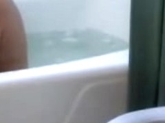 Old lady is taking a bath on hidden camera by a voyeur