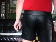 Paddled in Priape leather shorts