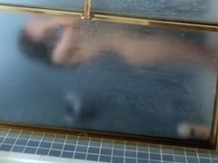 Dark haired girl in the shower sexy naked body view