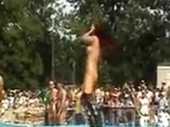Strippers work the stage at an outdoor party