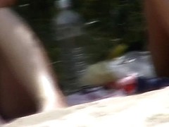 Hidden cam films some hot babes sunbathing on beach