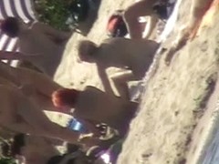 Tiny cutie caught on a nudist beach voyeur cam