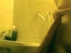 Beautiful girl with yummy butt washing her face